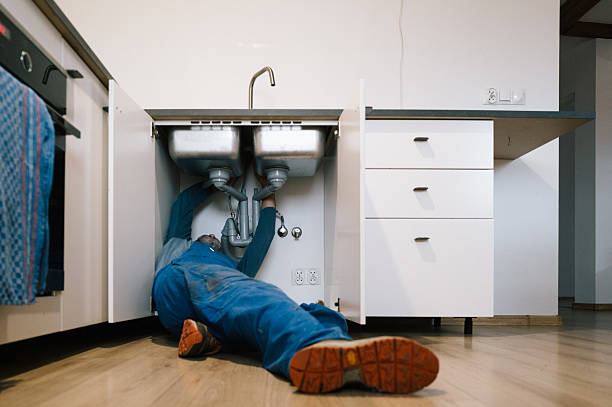 Professional Emergency Plumber technician working in Pine Lake, GA